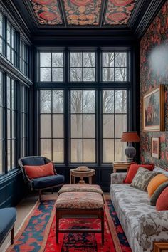 a living room filled with furniture and lots of window panes on the wall above it