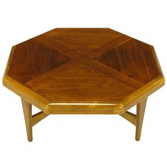 a wooden coffee table with an octagonal design