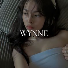 a woman laying on top of a bed wearing a white dress and headband with the words wynne written above her