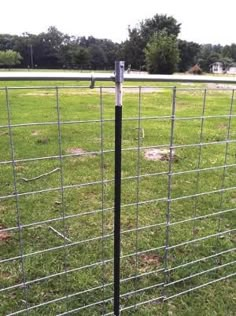 a fence that is sitting in the grass