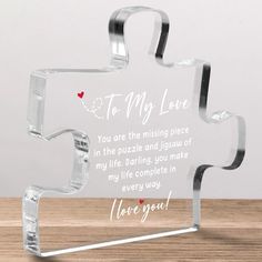 a glass puzzle piece with the words to my love on it