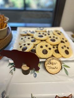 cookies and crackers are arranged on a table