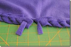 a close up of a purple cloth on a cutting board