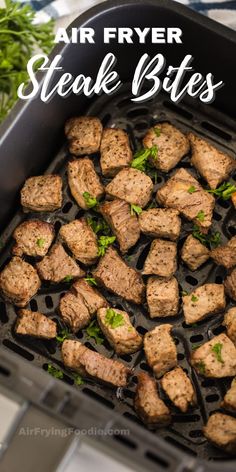 air fryer steak bites in a pan with parsley on top and text overlay that says air fryer steak bites