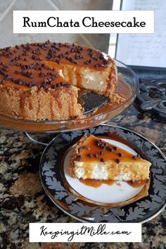 a cheesecake with chocolate chips and caramel sauce on top is sitting on a plate