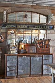 an old fashioned kitchen with lots of cooking utensils