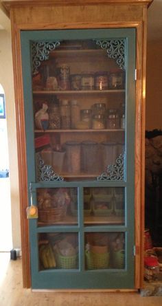 an old china cabinet with glass doors and shelves