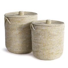 two woven baskets with handles on each side, one in white and the other in beige