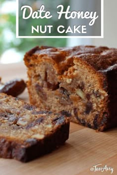 a banana nut cake cut in half on top of a wooden cutting board with the words date honey nut cake