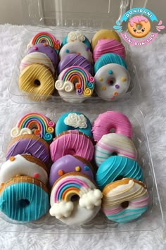 two plastic containers filled with donuts covered in frosting