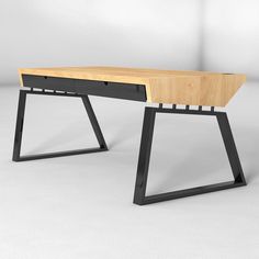 a wooden desk with black metal legs