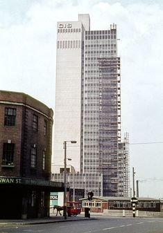 a tall building sitting on the side of a road