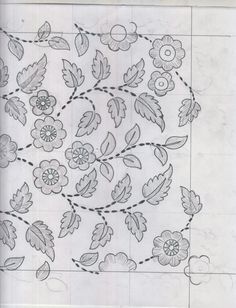 an intricately designed tile with leaves and flowers on it