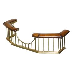 a wooden bench sitting on top of a metal frame next to a white wall in the shape of a curved staircase