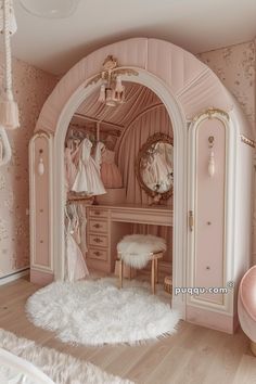 a dollhouse bedroom with pink walls and white fur rugs on the floor, an arched doorway leading to a dressing room