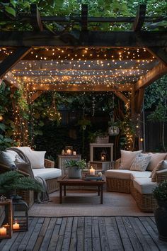 an outdoor living area is lit up with string lights