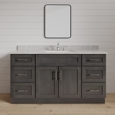 a bathroom vanity with a mirror above it