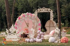 an outdoor wedding setup with pink and white decorations