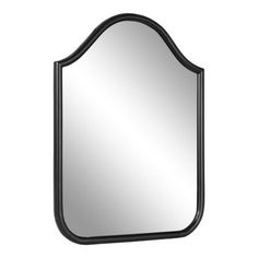 a black framed mirror on a white wall