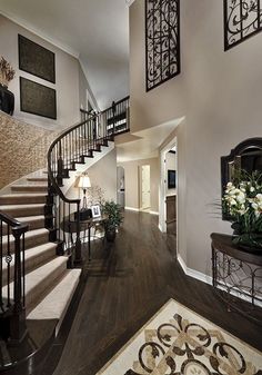 a large foyer with stairs leading up to the second floor