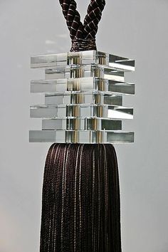 a sculpture made out of glass blocks and rope