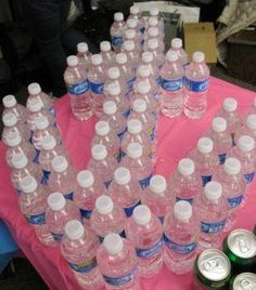 a table topped with lots of bottles of water