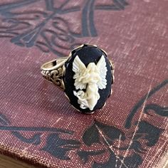 Angel Cameo Ring in Antiqued Brass or Silver | Ragtrader Vintage Cameo Ring Antique, Opera Wedding, Darkest Academia, Cosplay Fashion, Interesting Jewelry, Octopus Necklace, Typewriter Keys, Cute Angel, Golden Trio