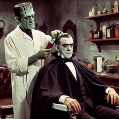 a man getting his hair cut by another man in a barbershop with an alien mask on