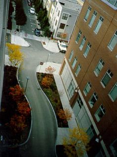 an aerial view of a city street and buildings