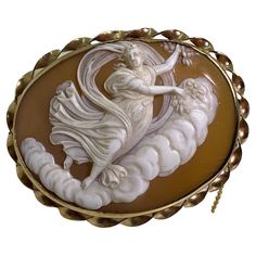 An Antique Victorian Finely Carved Shell Cameo Brooch with a bail - provision to wear a piece as a pendant within a 9K Yellow Gold decorative rope border featuring safety chain beautifully detailed, depicting Goddess wearing dress Brooch measures 52mm x 42mm, weighing 11.2gr. Victorian, circa 1870’s In excellent condition Mythology Jewelry, Floral Ribbon, Cameo Jewelry, Victorian Gold, Carved Shell, Cameo Brooch, Pin Pendant, Cameo Pendant, Gold Brooches