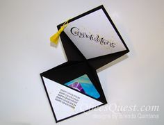 an origami business card with a yellow tassel