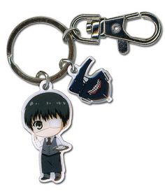 an anime keychain with a person holding a knife on it's side