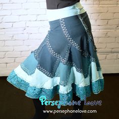 This is really some of my very best and most original work. Sometimes you can find upcycled denim patchwork skirts on places like Etsy, but I've never seen any like mine - made with colored denim and absolutely loaded with metallic thread embroidery, lace and sequins painstakingly sewn on by hand with invisible thread. The photos don't do them justice. I scour thrift shops for hours to find just the right denim that's lightweight and stretchy, so these aren't too heavy. Can you believe these are Paneled Skirt Pattern, Spiral Skirt, Patchwork Dress Pattern, Patchwork Skirts, Invisible Thread, Patchwork Denim Skirt, Boho Wear, Turquoise Ombre, Festival Skirt