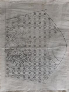 a drawing of a dragon on top of a piece of paper with circles around it