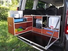 an open trunk in the back of a van