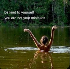 a woman is in the water with her arms spread out and there is a quote above her that says, be kind to yourself you are not your mistakes