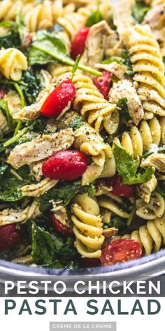 a pasta salad with chicken, spinach and tomatoes