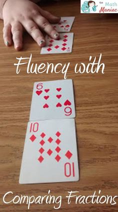 two playing cards with the words flueny with comparing fractions