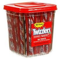 red twinkies are in a plastic container on a white background with the words, twizzlers