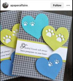 two cards with hearts and paw prints on them