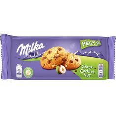 milka cookies with chocolate chips and nuts on the top, in a purple wrapper