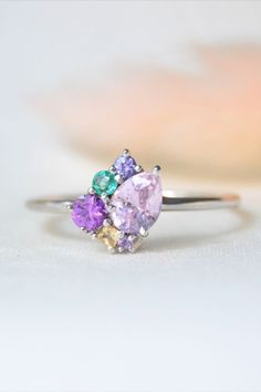 a pastel themed sapphire ring with unique shapes. Pink Gemstone Engagement Rings, Pink Cocktail Ring, Cluster Jewelry, Sapphire Cluster Ring, Colored Engagement Rings, Pink Sparkle, Classic Engagement Rings