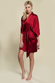 Incredibly soft and luxurious, our signature Samantha silk robe has a beautiful drape that is elegant and oh-so-flattering. Wrap your body in luxurious 100% pure silk that looks just as amazing as it feels!A timeless getting ready robe for your big day, and perfect honeymoon lounge wear for the days to come. Style with lingerie or your favorite silk slip for a glamorous look that can be worn long after the wedding.Designed with wide kimono sleeves, fully lined cuffs and neck band (no visible sti Elegant V-neck Robe In Solid Color, Elegant Robe For Wedding Night, Elegant Red Robe For Loungewear, Elegant Red Lounge Robe, Elegant Bridesmaid Robe With Satin Finish, Elegant Red Wedding Robe, Getting Ready Bridesmaids, Red Silk Robe, Lingerie Bridal Shower