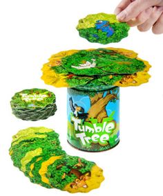 a hand reaching into a can filled with trees