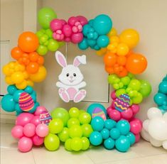 a bunch of balloons that are in the shape of an easter bunny and some bunnies