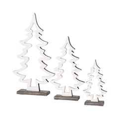 three metal christmas trees sitting next to each other