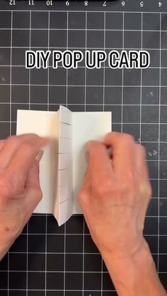 someone is making a pop up card out of paper