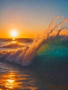 the sun is setting over an ocean wave