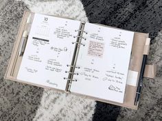 an open planner book with writing on it