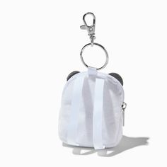 a small white purse with a metal keychain hanging from it's side